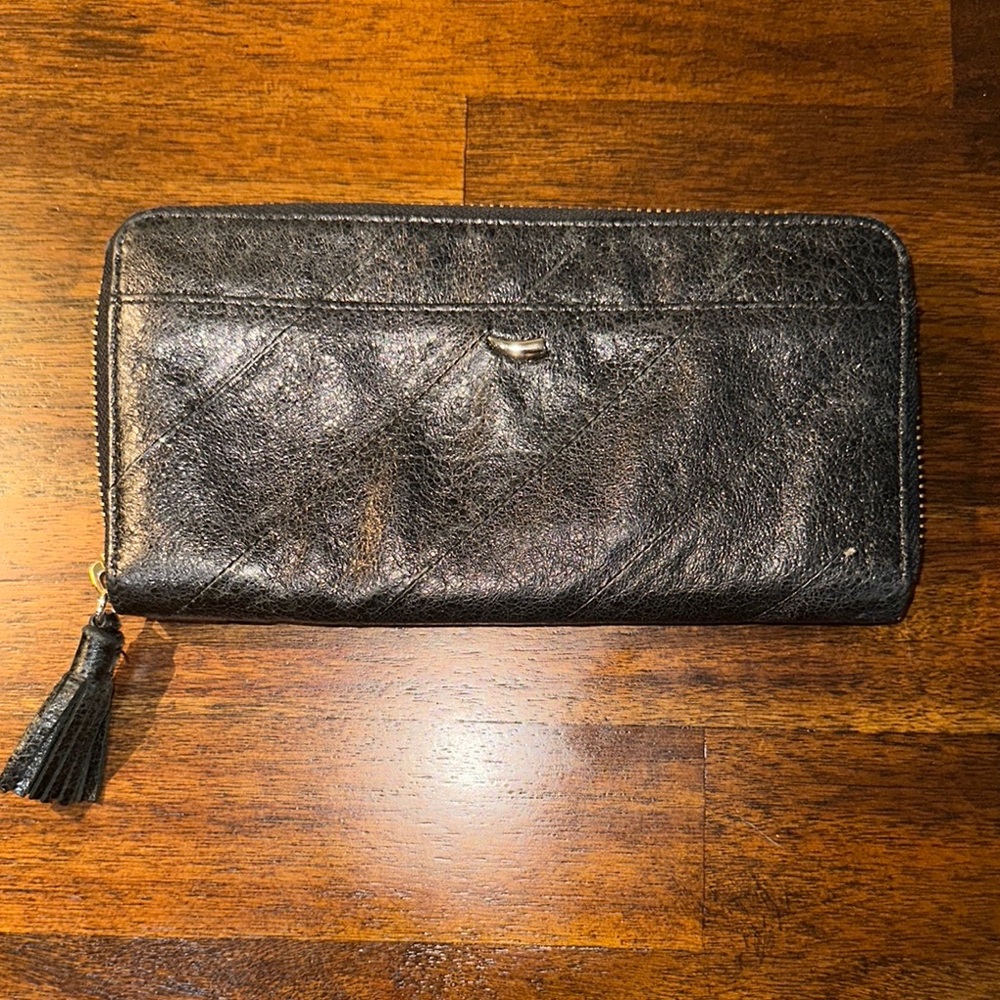 TUSK Black Wallet with Gold Accents.  Very soft leather. No signs of damage